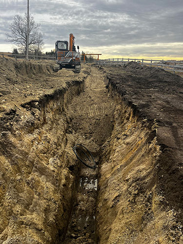 Image 4 - acreage development by Calgary's 2 Sons Excavating, waterline trenching.